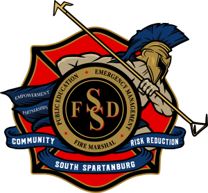 Logo of South Spartanburg Fire Department featuring a Spartan warrior with a spear, surrounded by banners with text: "Community," "Risk Reduction," "Public Education," "Emergency Management," "Fire Marshal," "Empowerment," and "Partnerships.